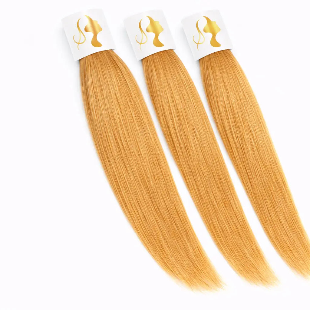  extensions 100% cheveux vierges Raw Hair en blond miel vénitien #18. Cette teinte dorée chaude et lumineuse apporte éclat et sophistication pour un effet ensoleillé inspiré des reflets vénitiens.